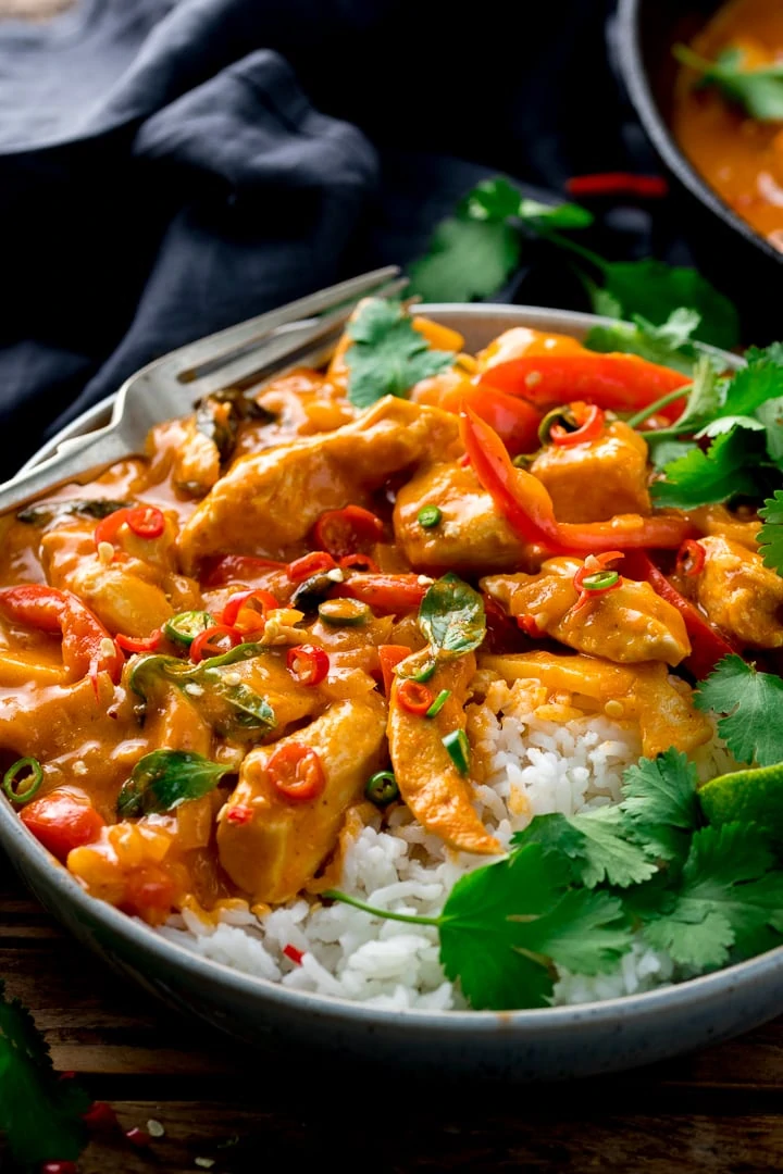 Thai red chicken curry with rice in a bowl