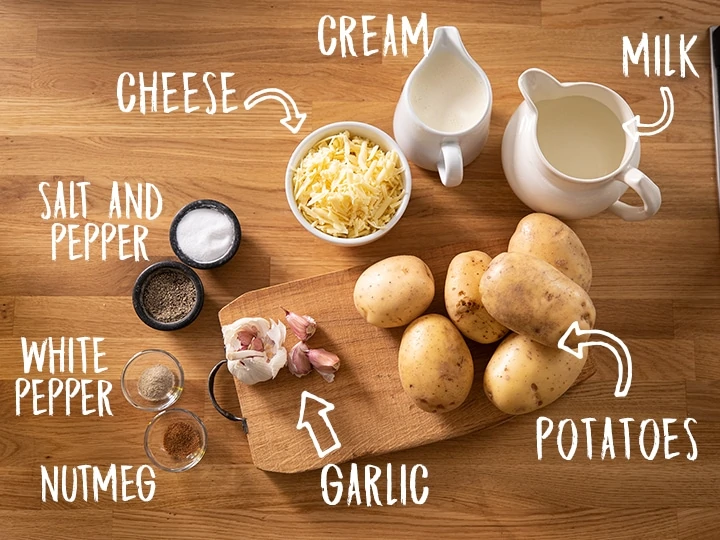 Ingredients for Dauphinoise potatoes on a wooden table