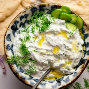 Bowl of Tzatziki with a spoon in