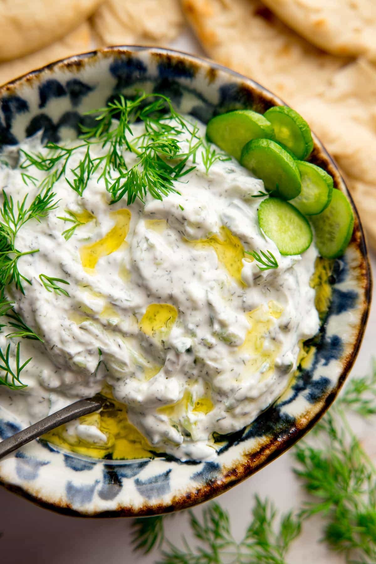 Tzatziki in a bowl on a light background