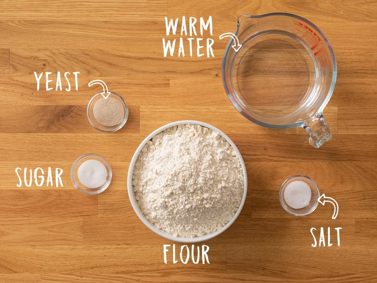 Ingredients for making Artisan Bread on a wooden table