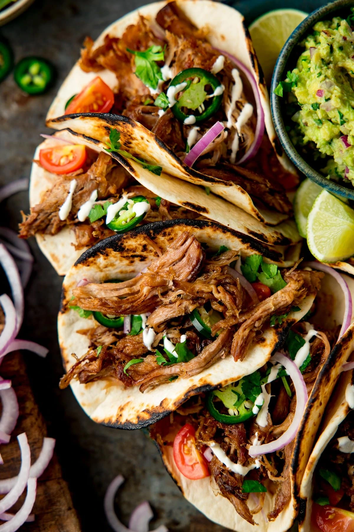 Lamb Barbacoa Carnitas Tacos piled up on a plate