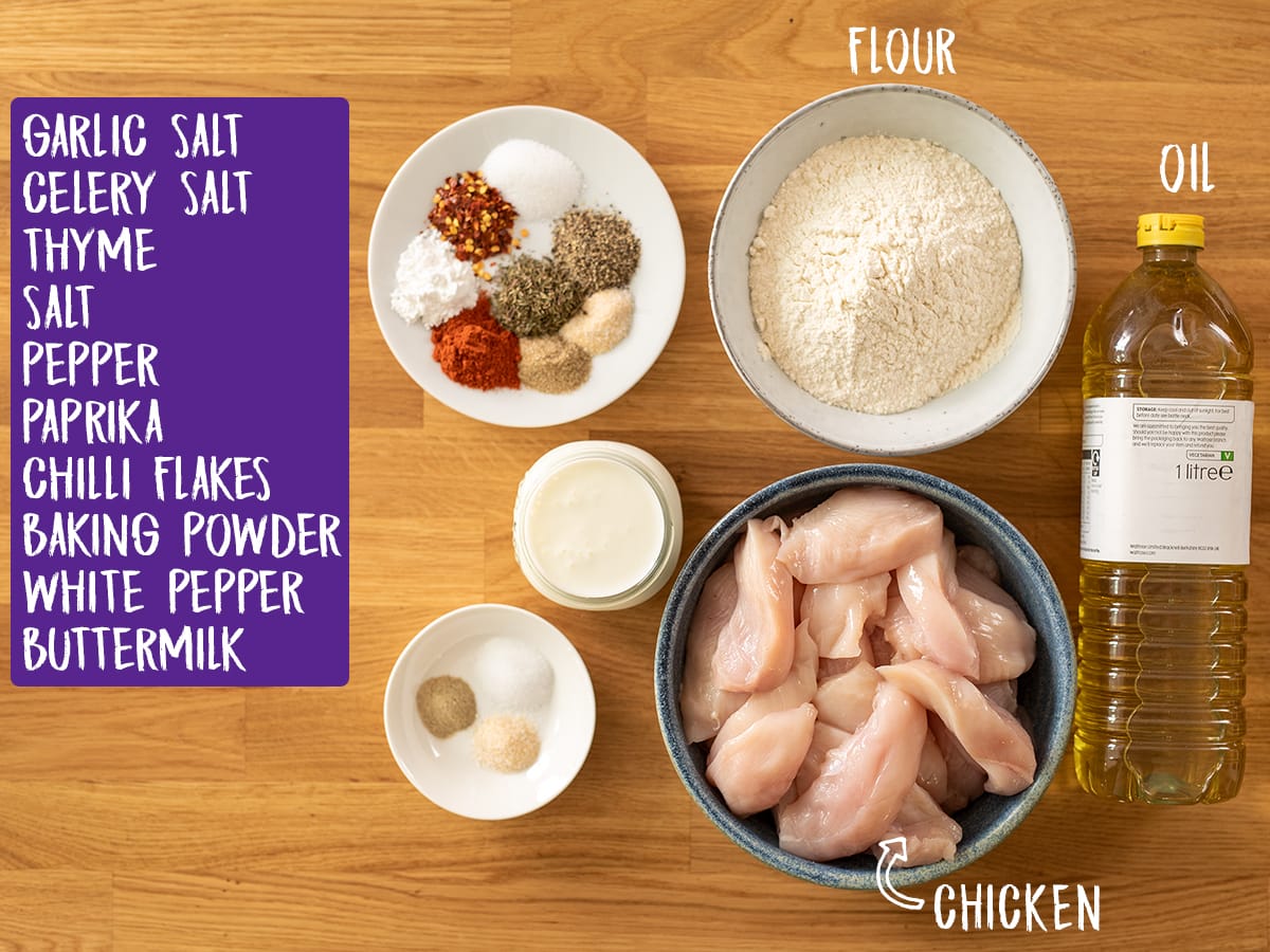 Ingredients for crispy chicken on a wooden table