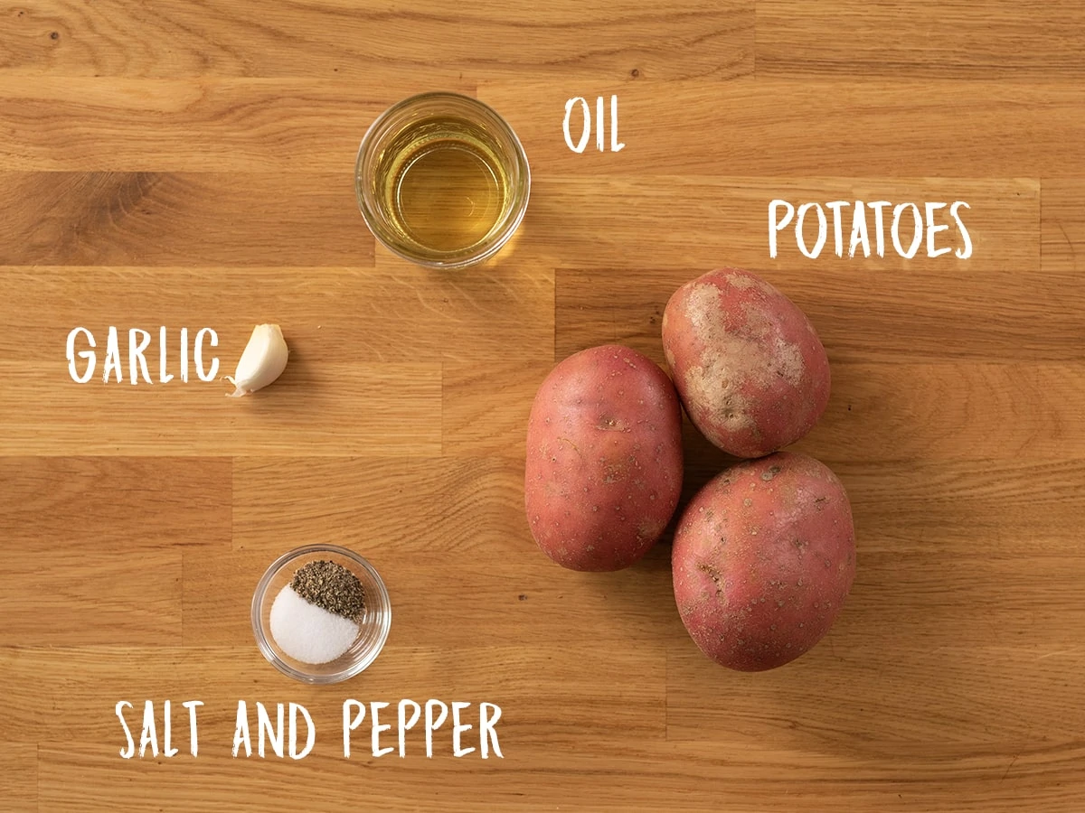 Ingredients for saute potatoes on a wooden table