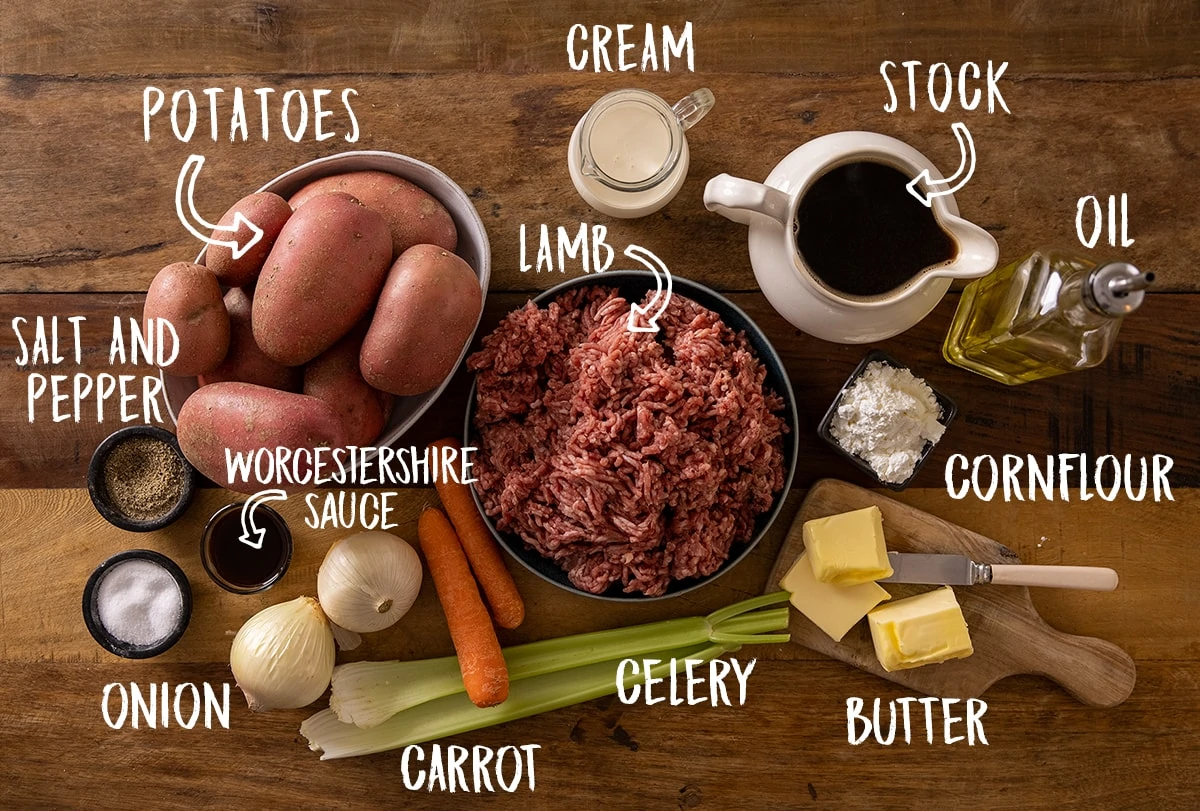 Ingredients for Shepherd's pie on a wooden table