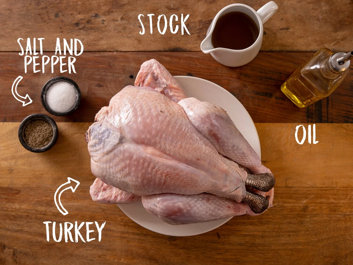 Ingredients for roast turkey on a wooden table