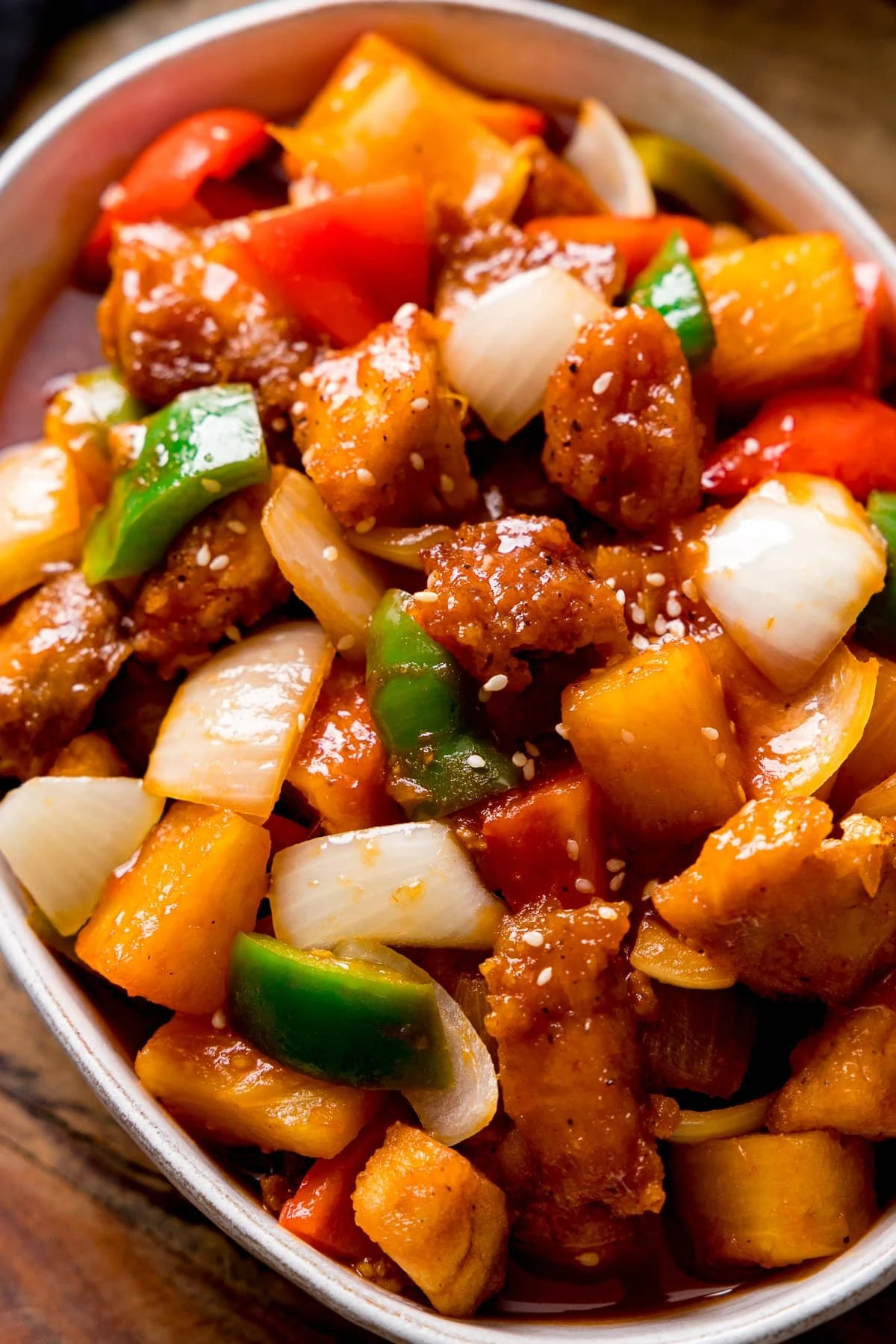 Close up of Sweet and sour turkey in a white bowl.