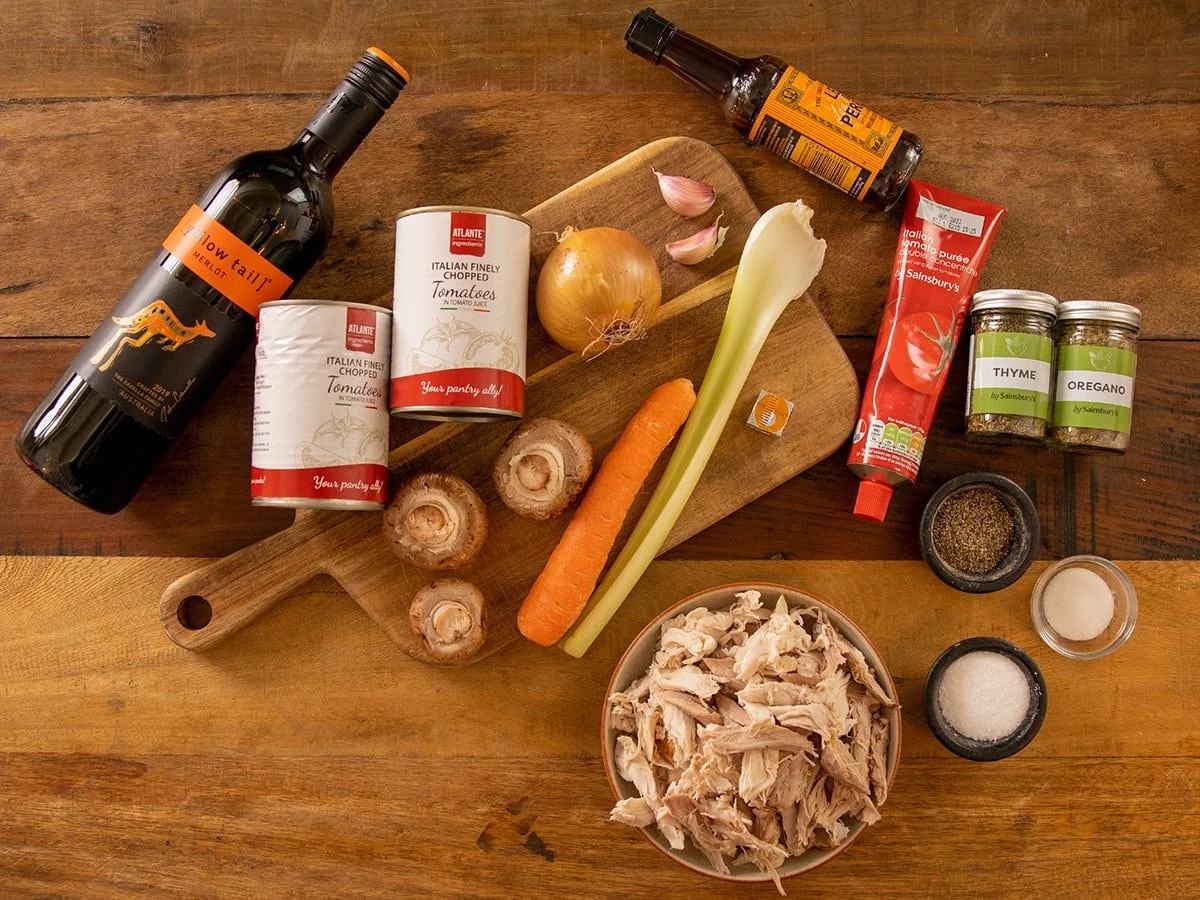 Ingredients for Leftover Turkey Bolognese on a wooden table
