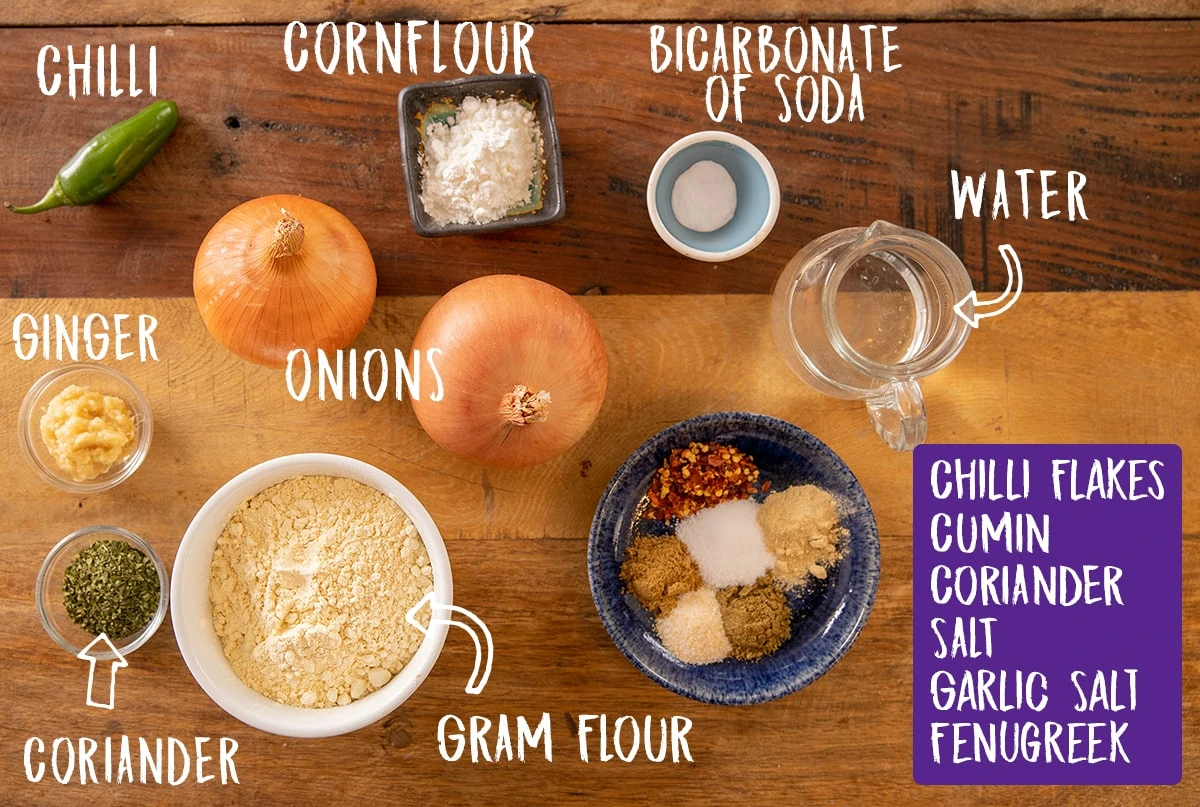 Ingredients for onion bhaji on a wooden table
