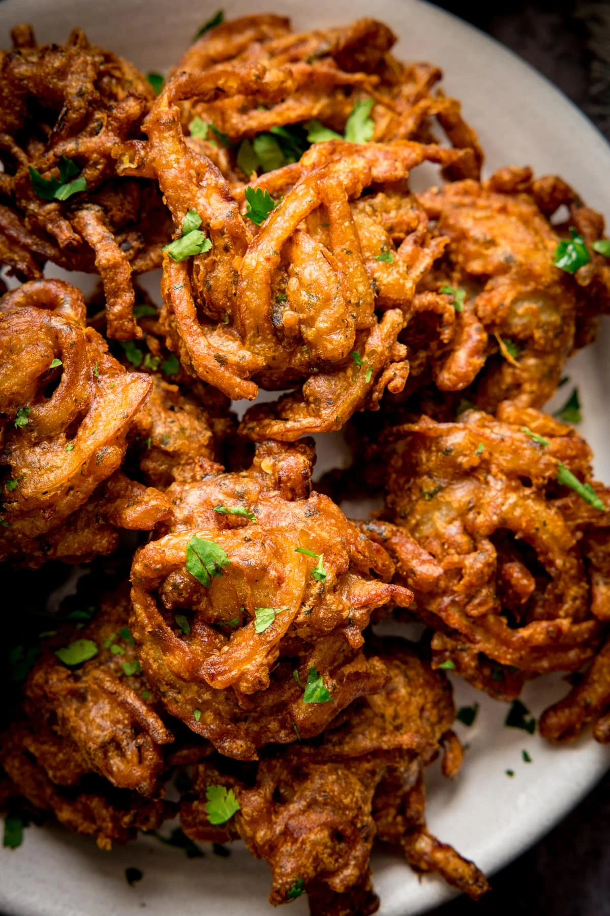 Close up of Onion bhajis on a white plate