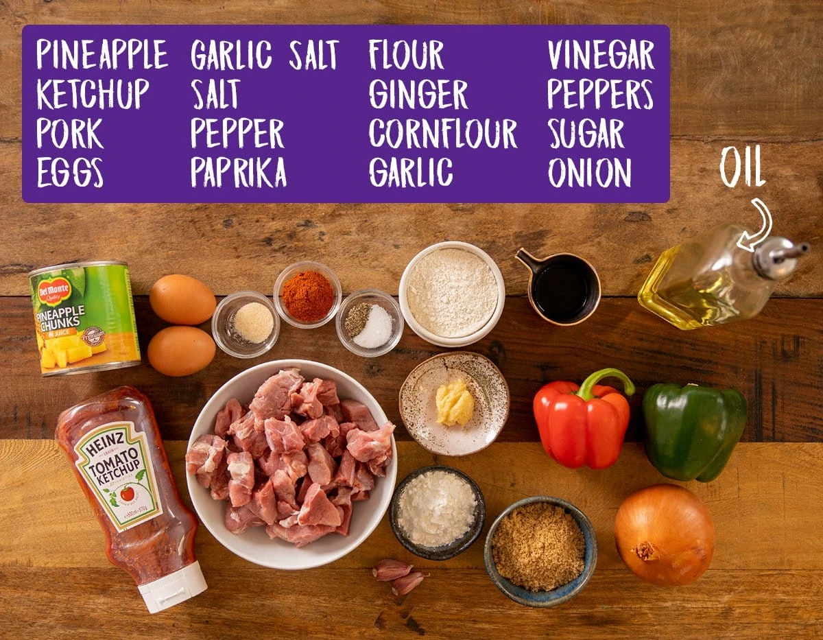 Ingredients for sweet and sour pork on a wooden table