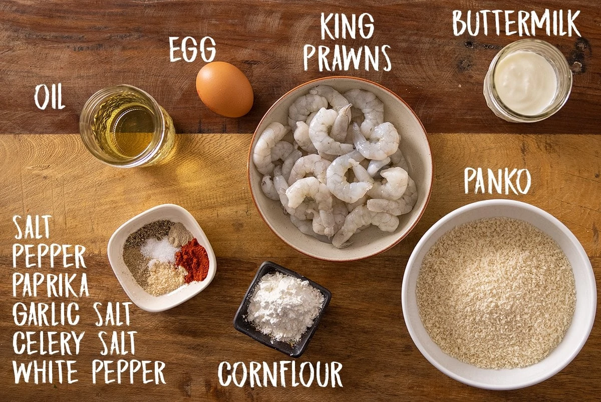 Ingredients for crispy shrimp on a wooden table.