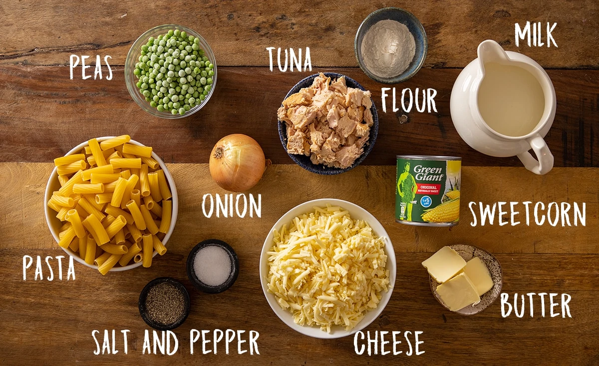 Overhead picture of Tuna Pasta Bake ingredients on a wooden background.
