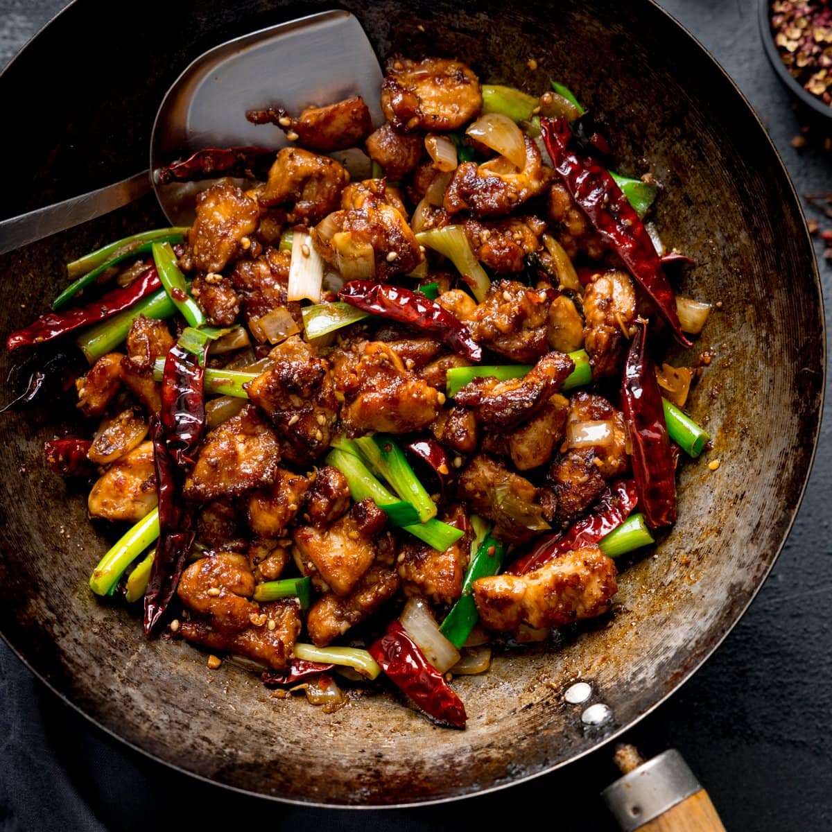 Szechuan chicken stir fry in a wok