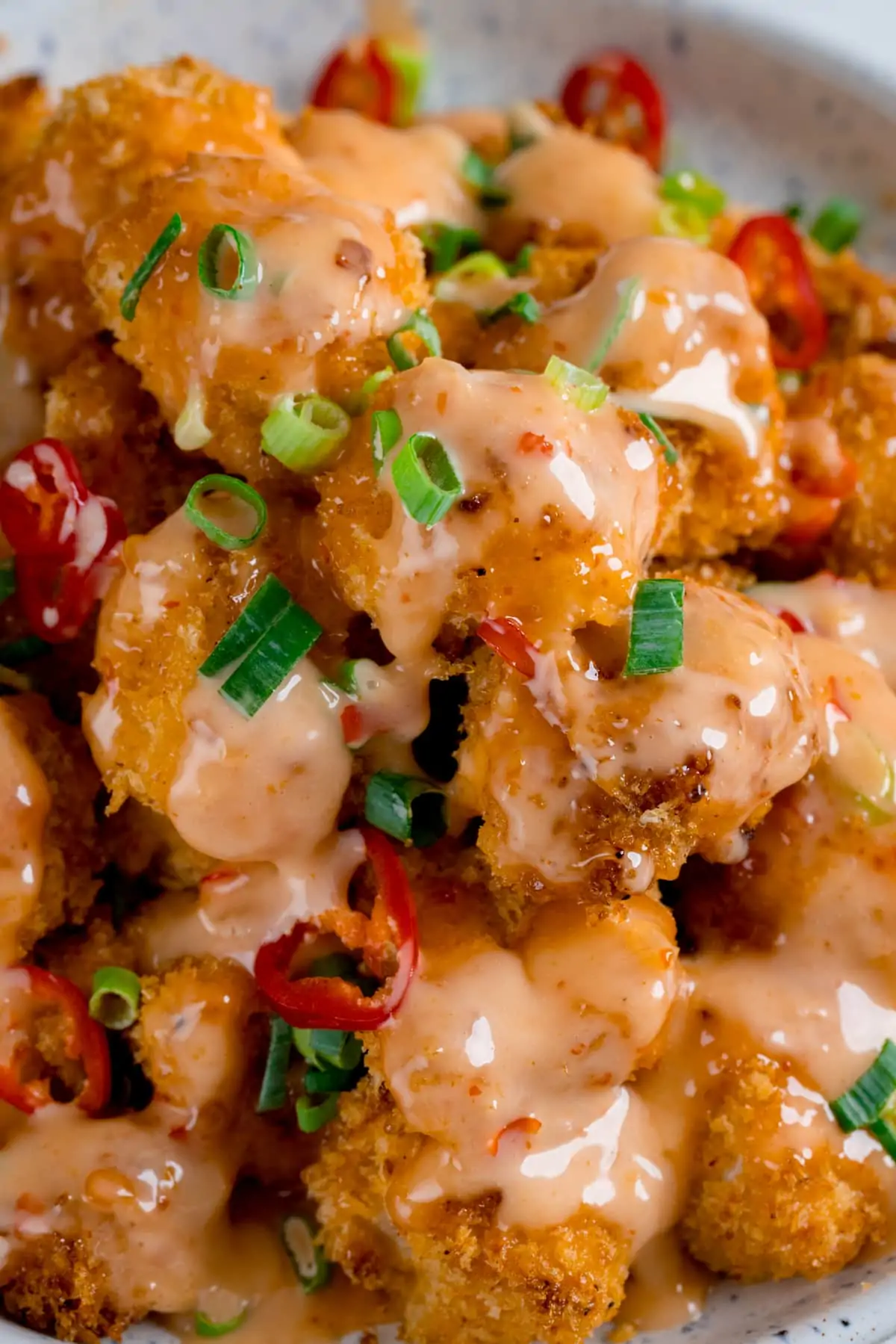 Crispy chicken pieces smothered in bang bang sauce, topped with spring onions and chillies