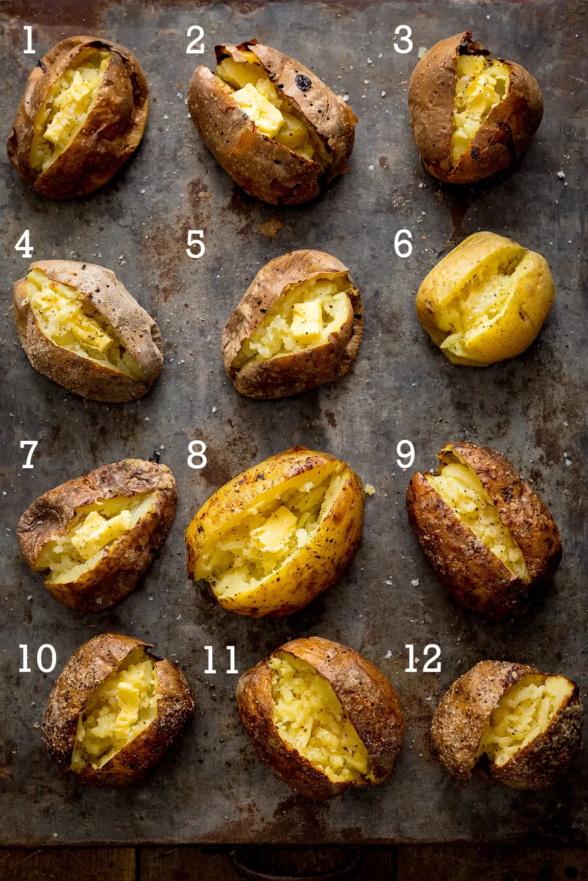 12 open baked potatoes on a metal tray - each with a number from one to ten.