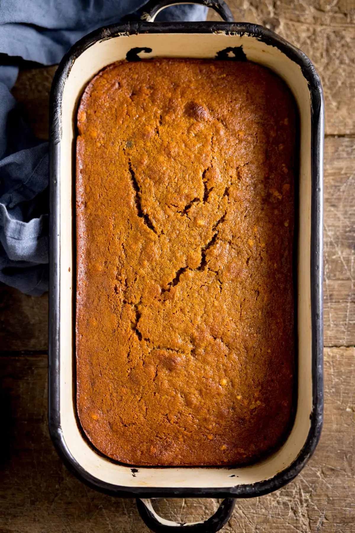 Overhead of sticky toffee pudding before the sauce has been poured on.