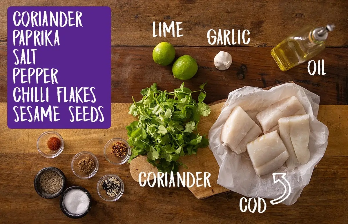 labelled ingredients for cod bake on a wooden board.