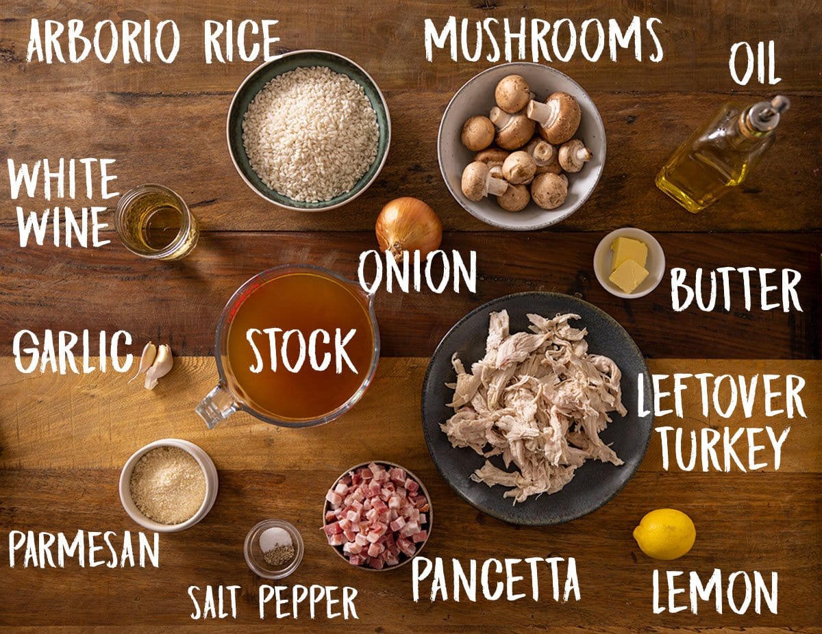 Ingredients for a Turkey risotto on a wooden board with labels.