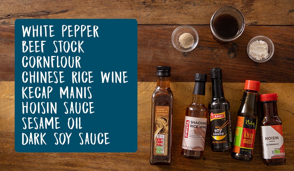 Overhead photo of Ingredients for chow mien sauce on a wooden table.