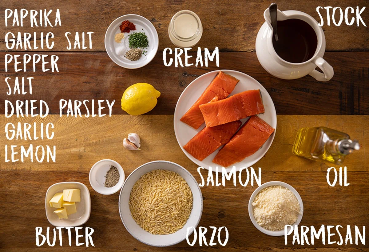 Ingredients for Salmon with creamy lemon orzo on a wooden table