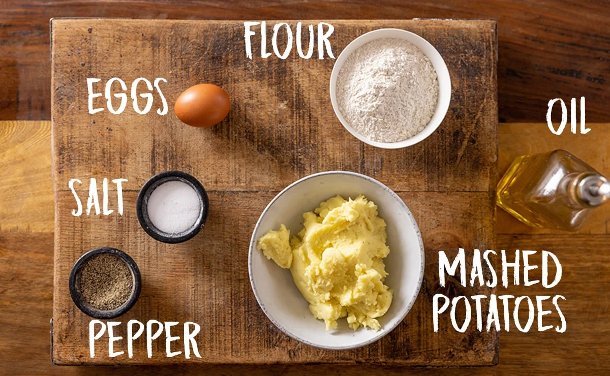 Ingredients for making gnocchi on a wooden board.