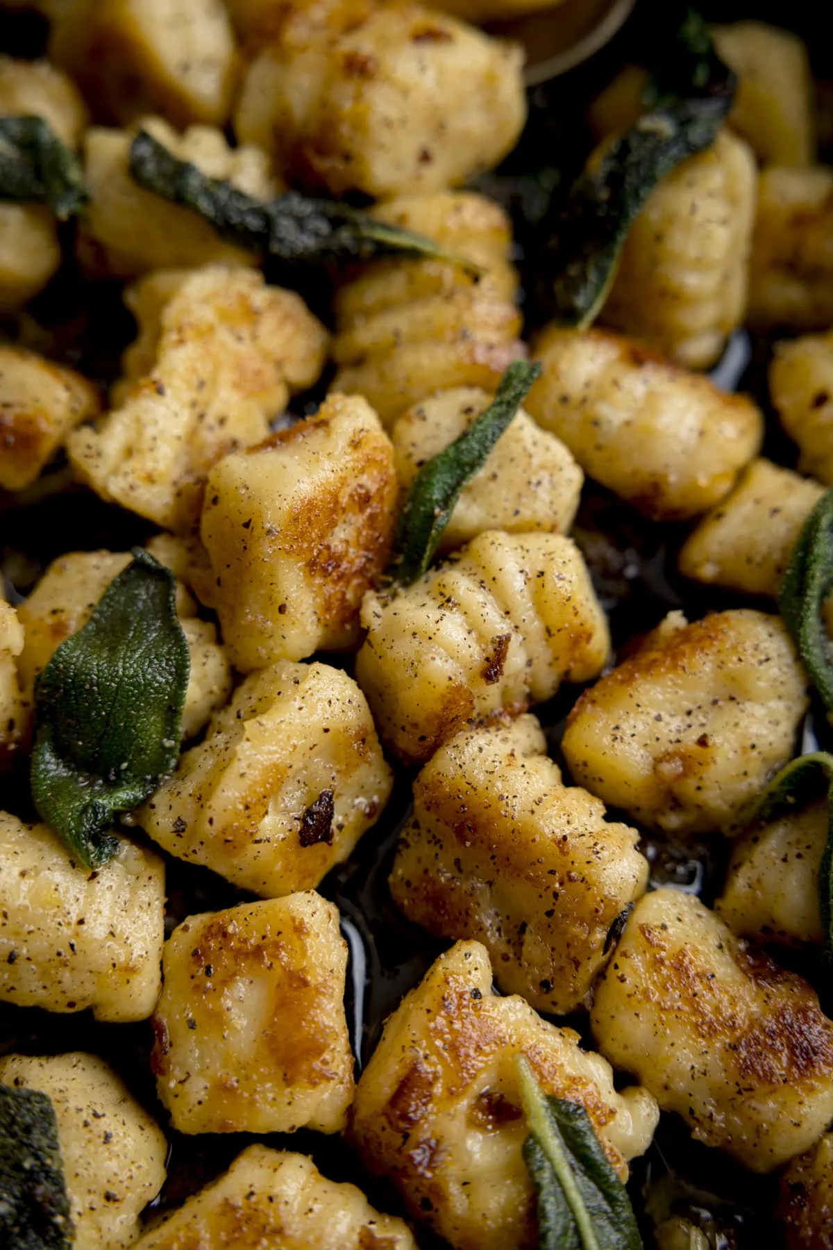 Close up of pan-fried gnocchi with brown butter and sage