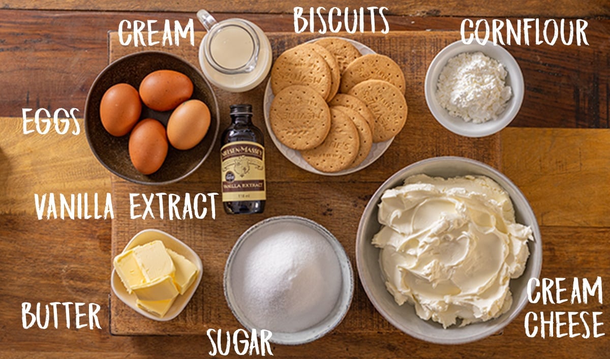 Ingredients for New York Cheesecake on a wooden table