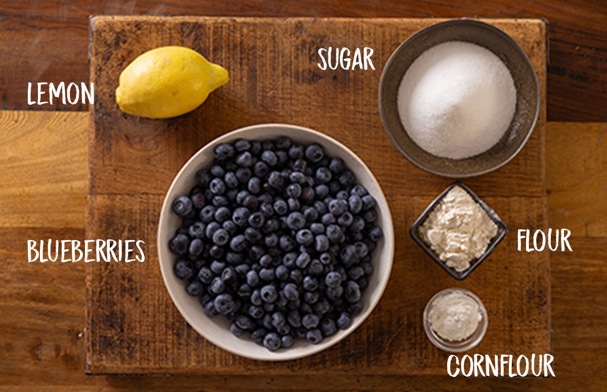 Labelled ingredients for homemade blueberry pie filling.