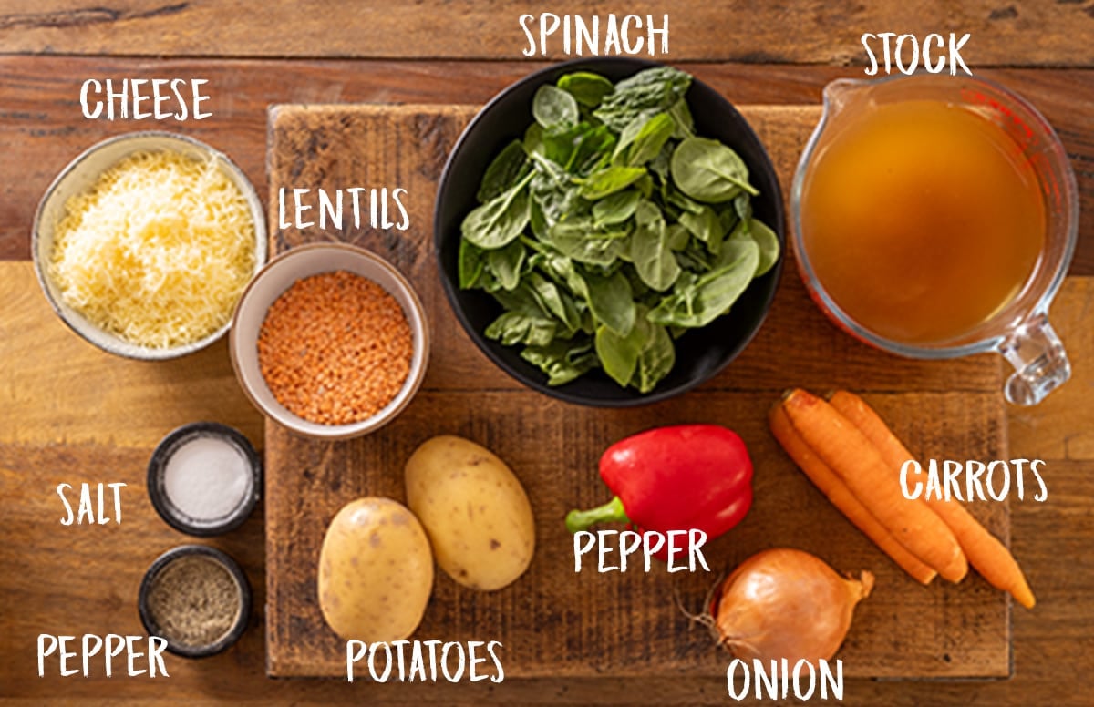 Ingredients for slow cooker lentil soup on a wooden board.