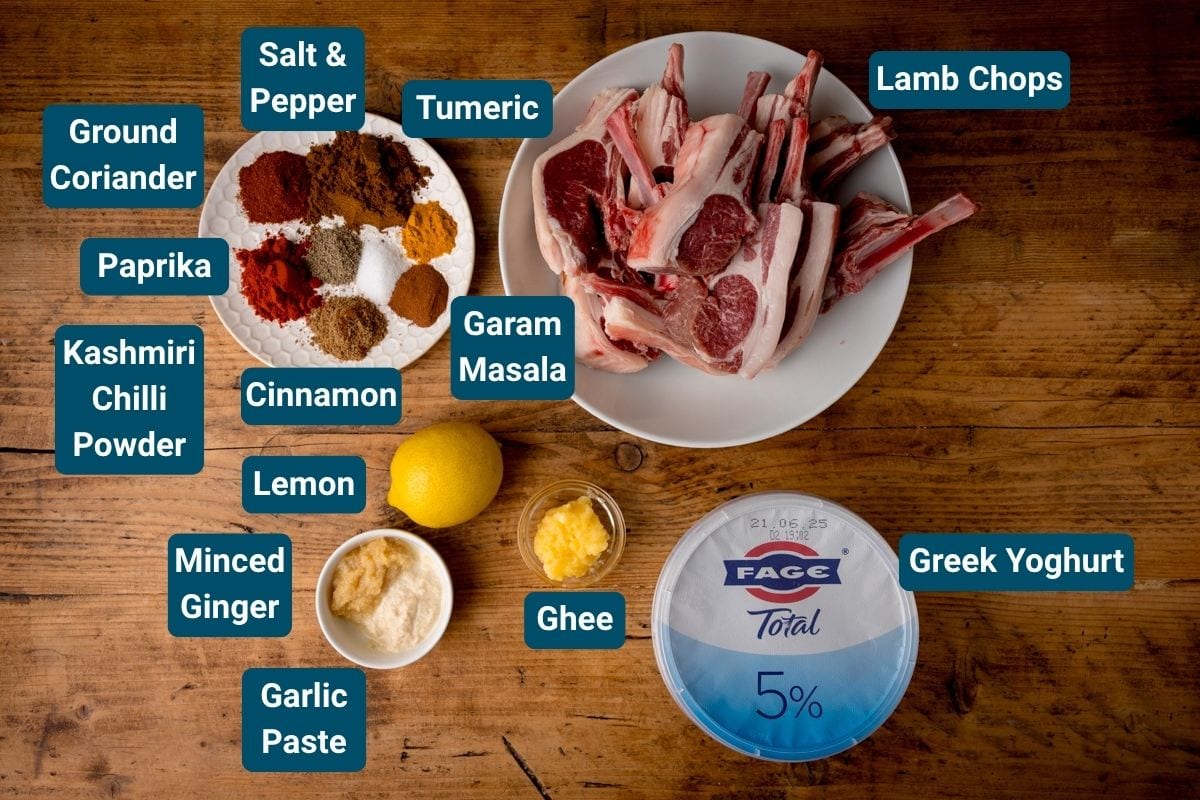 The ingredients for Tandoori Lamb Chops with spices such as ground coriander, paprika, Kashmiri chilli powder, cinnamon, turmeric, garam masala, ginger, garlic paste, lemon juice, salt and pepper. Each ingredient is labelled.